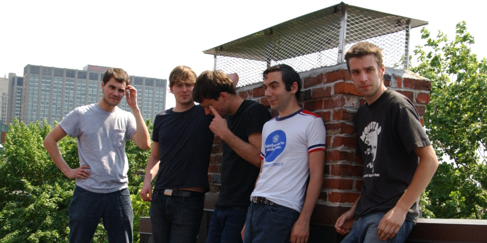 Band photo on a roof in Boston