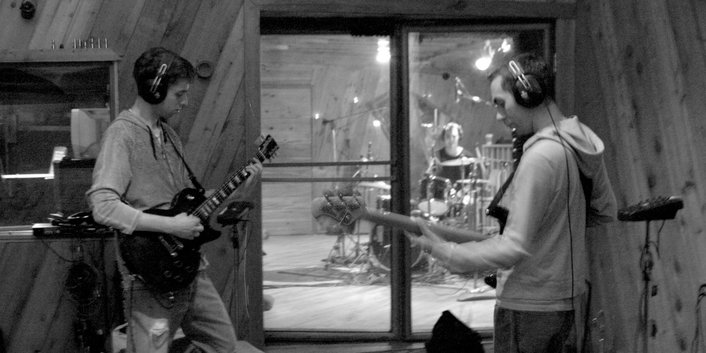 Brad on guitar, Brian on drums, Nick on bass, while recording One-Offs