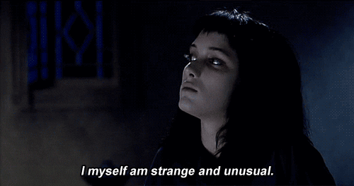 A scene from the movie Beetlejuice where Winona Ryder’s character says, “I myself am strange and unusual.”